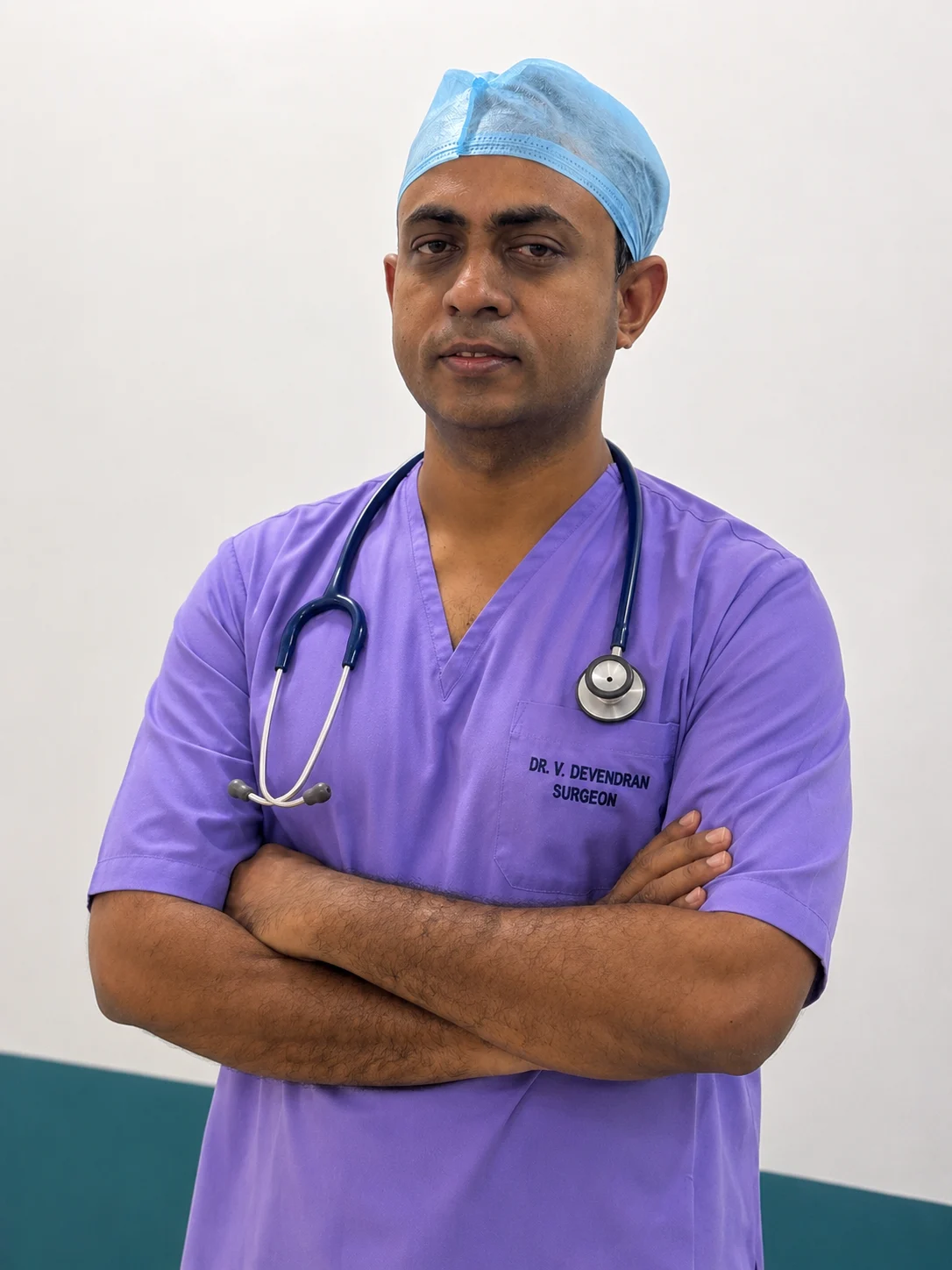 Dr. V. Devendran in surgical scrubs